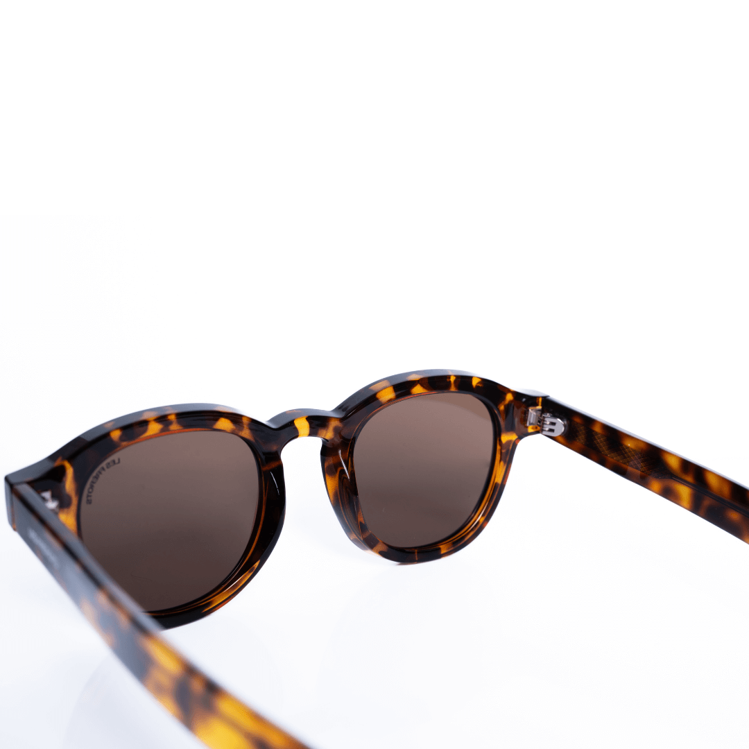 Vintage designed brown oval sunglasses, upper behind angle