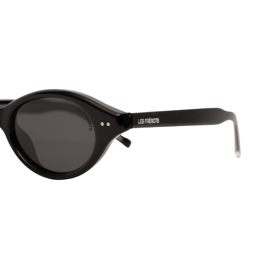 Black oval sunglasses for women, closer left side angle 