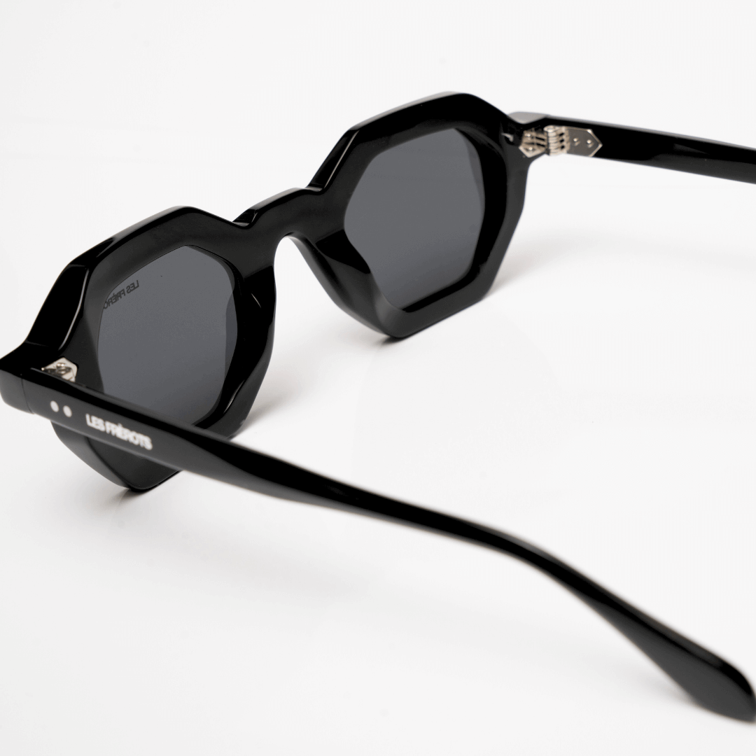 Black rectangle sunglases for men, behind upper angle