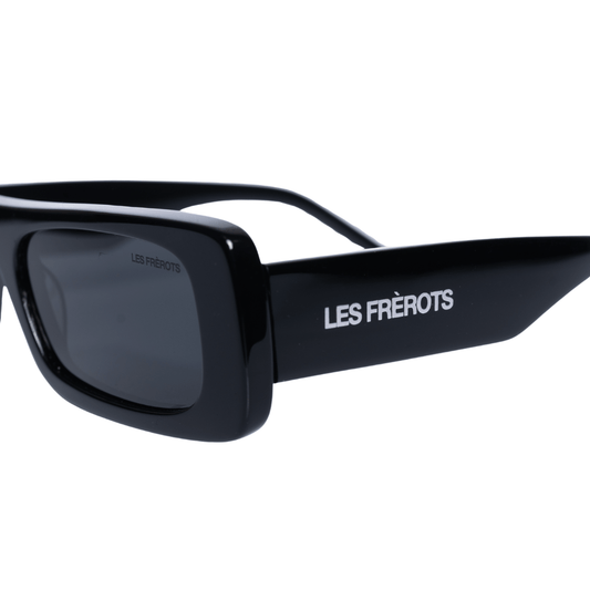 Futuristic black sunglasses, close front angle 