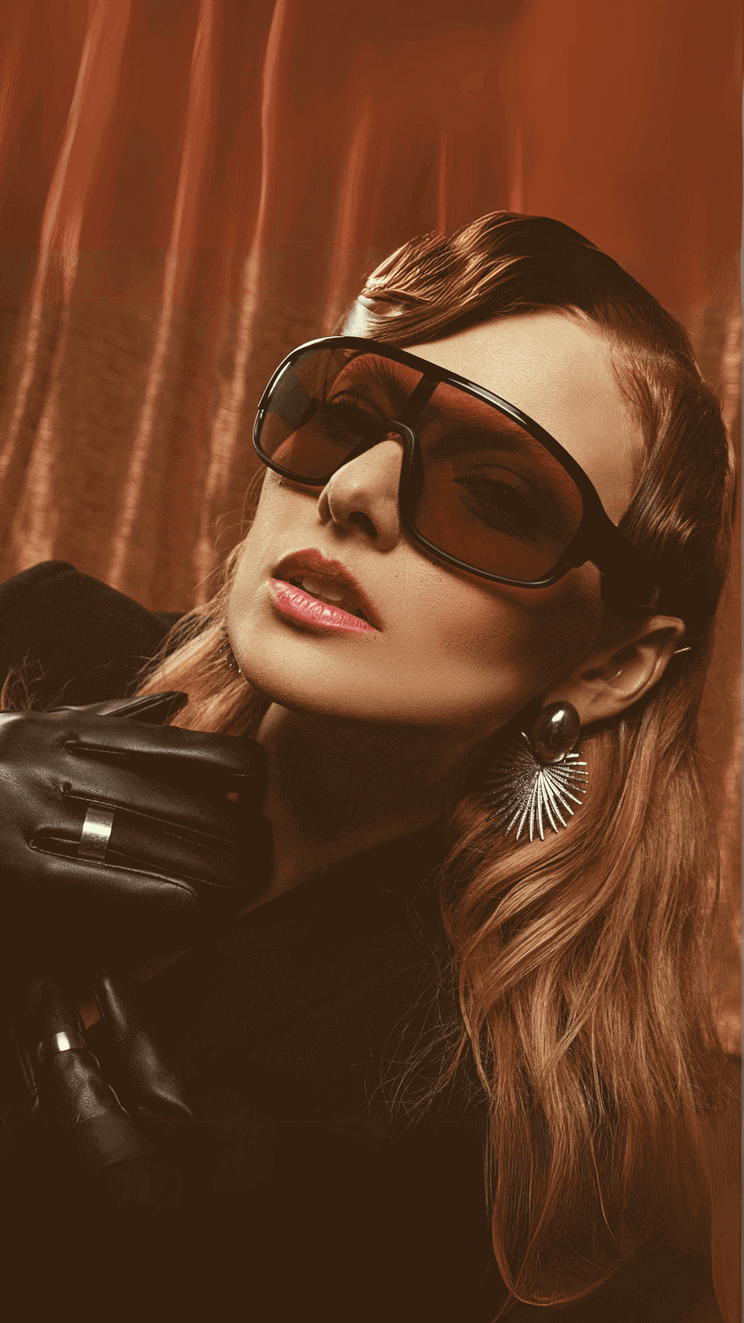 female model posing while wearing brown oversize sunglasses for women,front angle